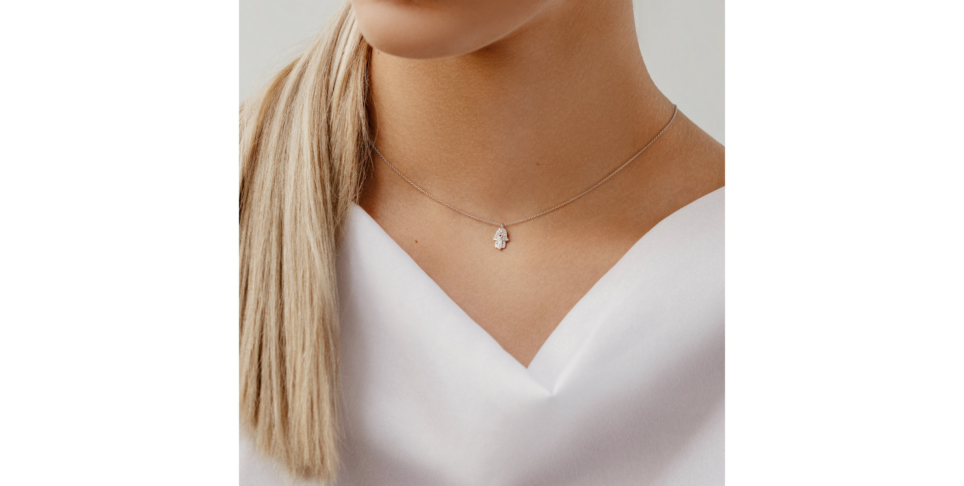 Diamond necklace with Sapphire Hamsa