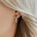 Earrings with white, brown and black diamonds Inferno Courier4
